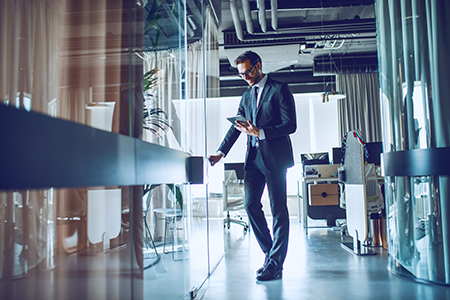 man entering glass office