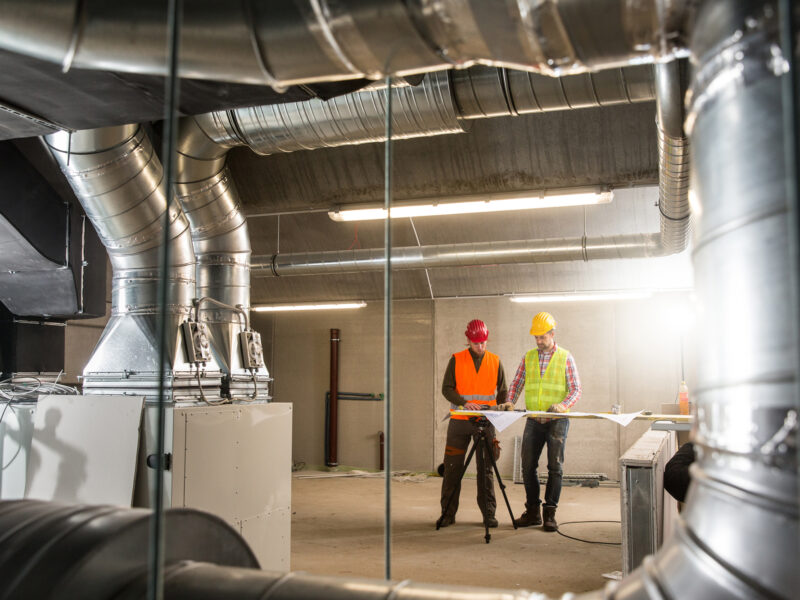 construction workers looking at plans