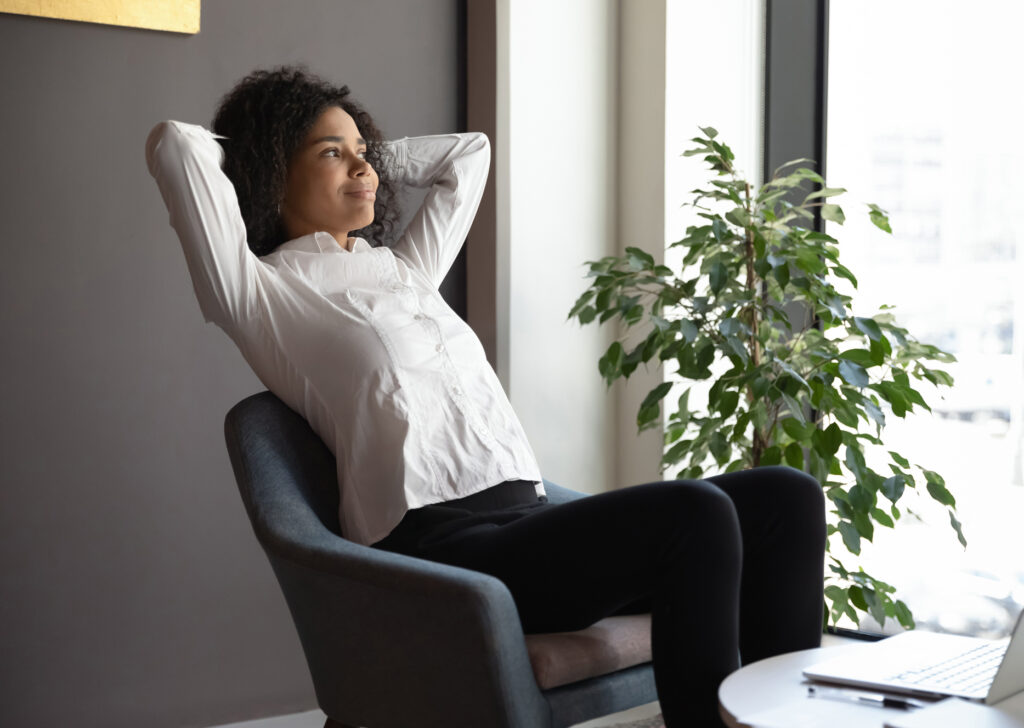 woman leaning back in chair