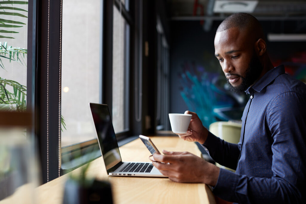 man working looking at phone