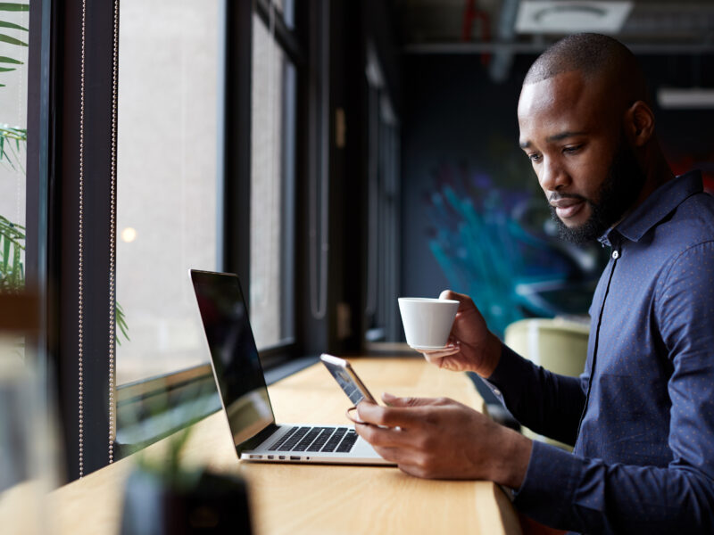 man working looking at phone