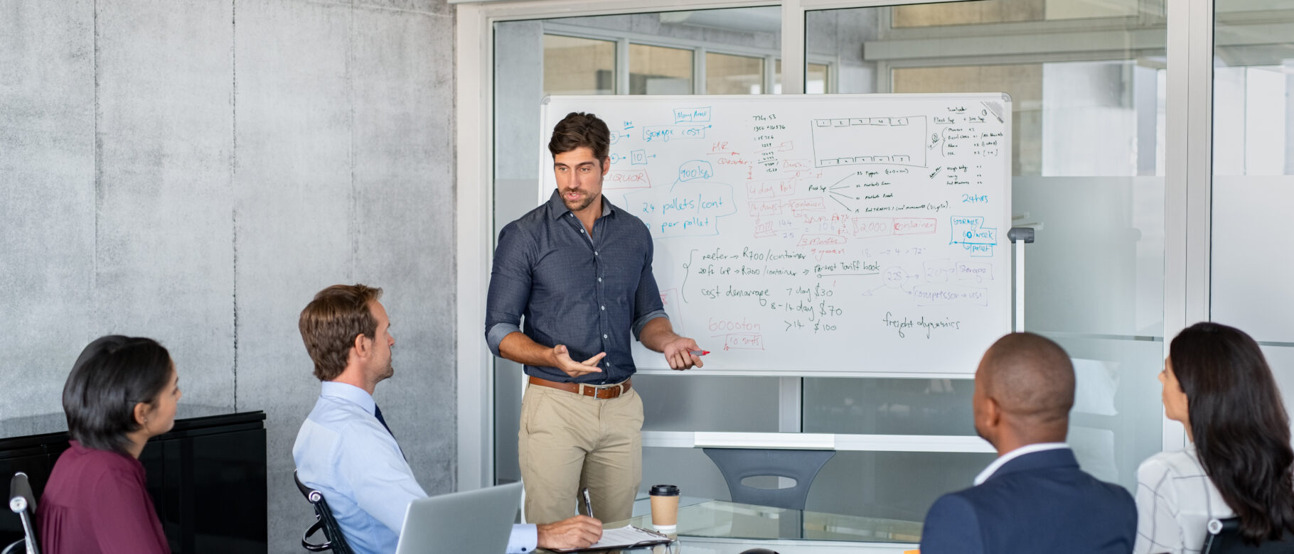 man presenting in conference room