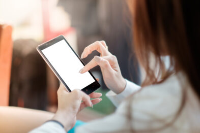 woman holding blank mobile phone