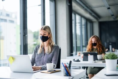 coworkers in office with masks