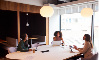 coworkers at office table