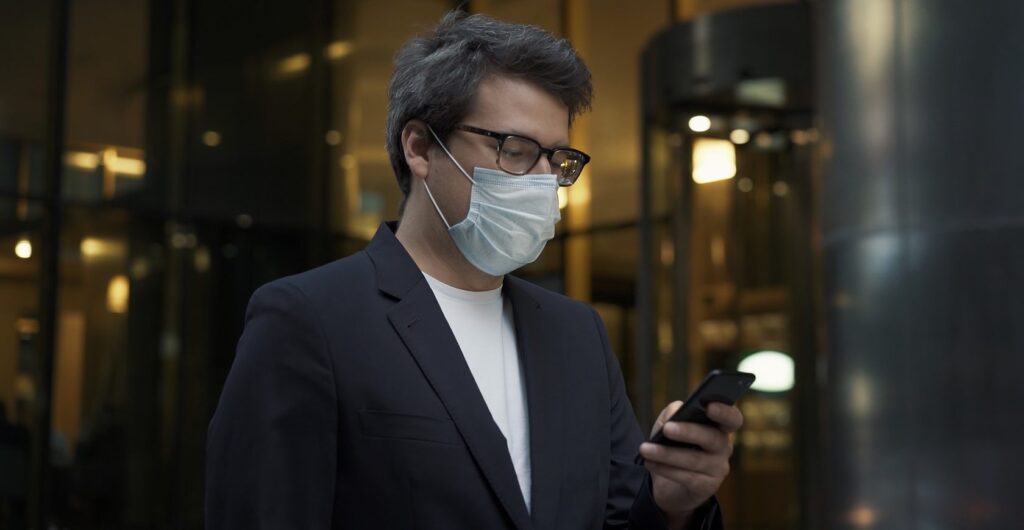 man entering building with mask