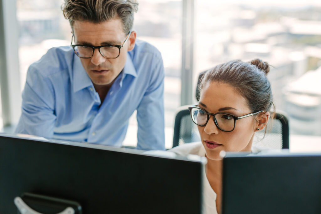 looking at computers in office