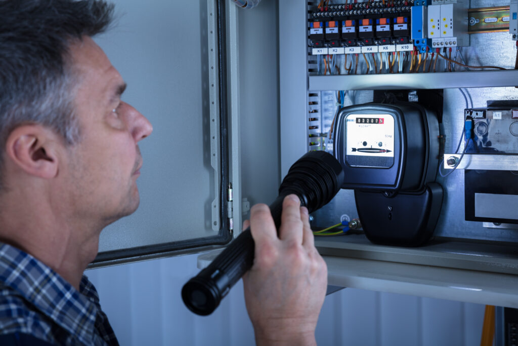 Electrician looking at meter